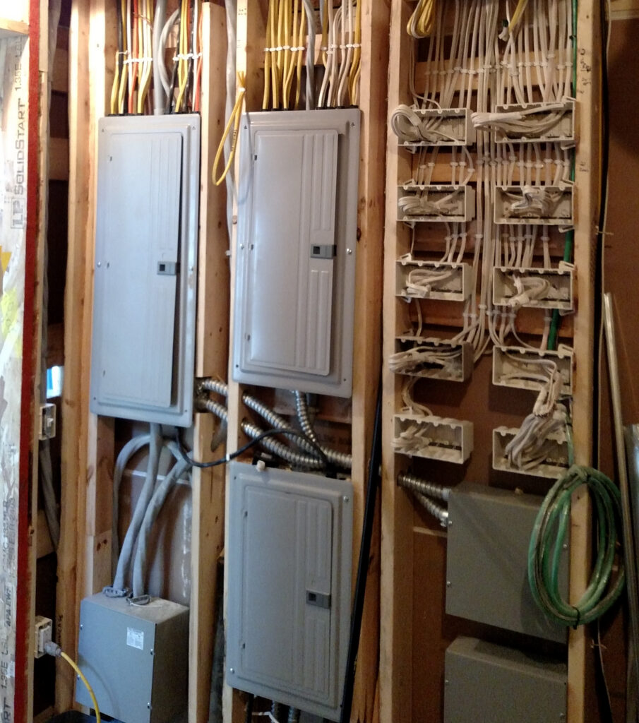 Organized elaborate switch and wiring rough-in for high-tech electronics in home.